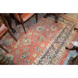 Large Indo Persian carpet of all-over floral design with multiple borders on a salmon ground,