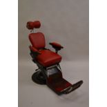 Early 20th Century black Japanned chrome and red leather upholstered barbers chair with fully