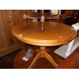 Reproduction circular pine extending dining table with a single extra leaf