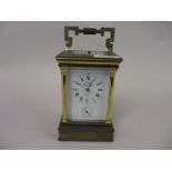 20th Century brass cased repeating carriage clock having enamel dial with Roman numerals and alarm