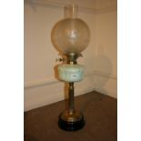 Victorian brass oil lamp with a blue glass well and an etched glass globe shade