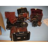 Rolleiflex twin lens camera in original case together with various other vintage bellows cameras