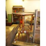 Pair of mahogany wine tables with circular tops and tripod bases,