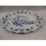 Oval blue and white tin glazed plate decorated with flowers