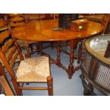 Good quality reproduction yew wood gate leg table on baluster turned supports with stretchers