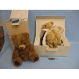 Modern boxed Steiff bear in a blue fleur de lis cape together with another modern Steiff boxed bear