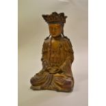 Fine quality antique carved and gilded figure of seated Buddha on an associated carved hardwood