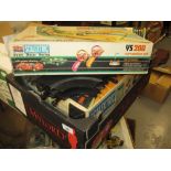 Box containing a quantity of various Scalextric sets including cars and track