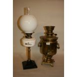Brass samovar together with a brass and pottery oil lamp with an opaque white glass shade