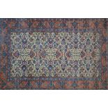 Small antique Tabriz rug with an all-over palmette design on an ivory ground with borders,