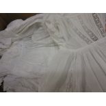 Box containing a collection of various late 19th or early 20th Century Christening gowns