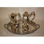 Silver plated tea service on an oval plated tray together with a large quantity of other