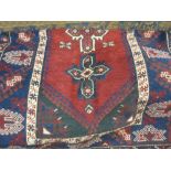 Turkish rug with triple medallion on a wine ground,