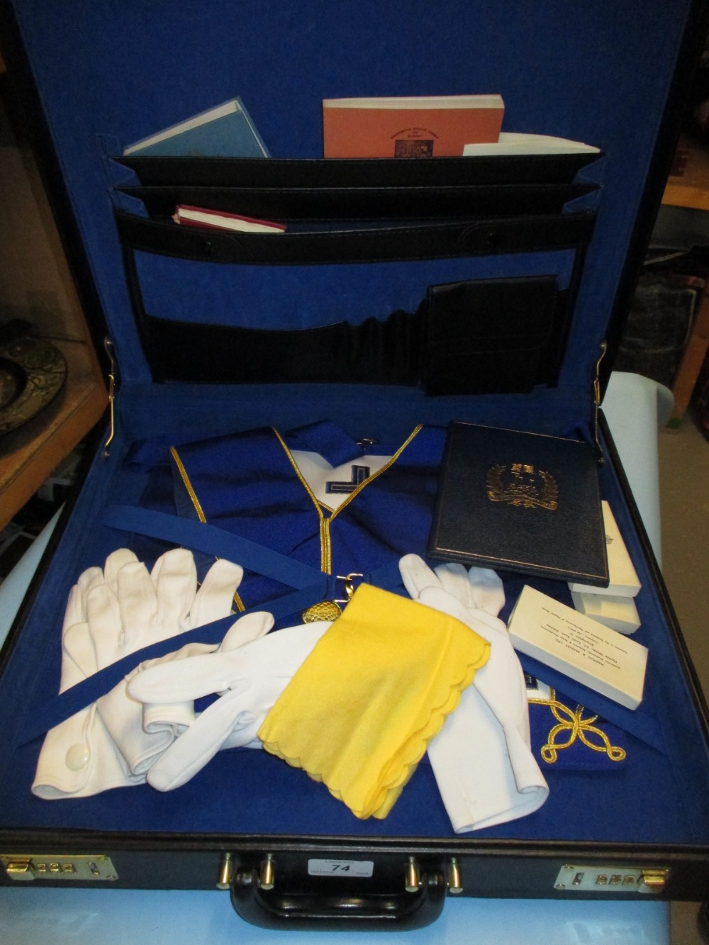 Two cases containing a quantity of Masonic regalia and books etc