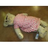 Mid 20th Century plush covered teddy bear wearing a red check dress together with a miniature teddy