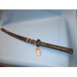 Japanese Samurai sword with bound shagreen grip and lacquered scabbard (restored),