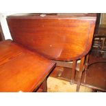 Edwardian mahogany and line inlaid Sutherland table on pierced end supports with splay feet