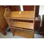Liberty & Company oak three shelf bookcase with pierced clover leaf design ends,