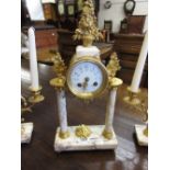 French gilt metal and white marble three piece clock garniture,