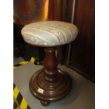 Victorian walnut adjustable circular piano stool on baluster turned column with platform base and