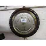 Circular oak cased aneroid barometer / thermometer by John Barker,