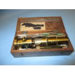 20th Century brass monocular microscope with slides in fitted box and a box containing a quantity