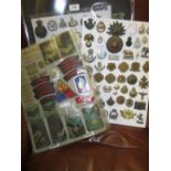 Quantity of various mixed British military badges and buttons including re-strikes mounted on cards