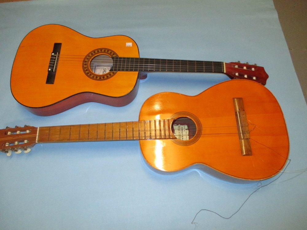 Classical guitar together with another children's guitar