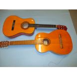 Classical guitar together with another children's guitar