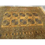 Afghan carpet of typical design on a gold ground,