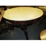 19th Century circular French mahogany centre table with a marble top raised on turned and carved