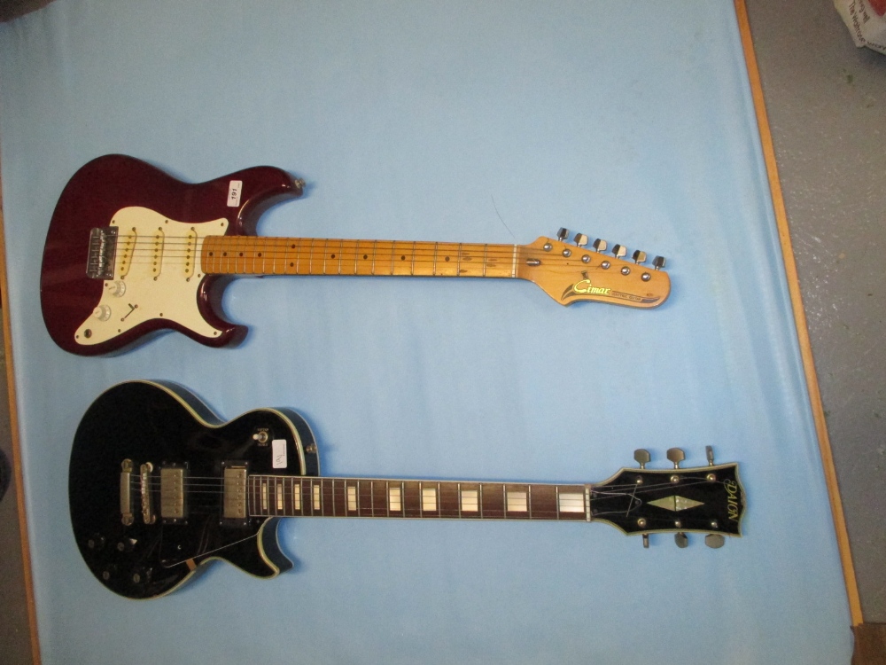 Cimax Stratocaster type electric guitar together with a Daion Les Paul type guitar
