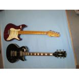 Cimax Stratocaster type electric guitar together with a Daion Les Paul type guitar