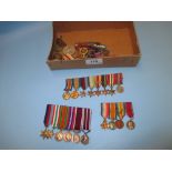 Quantity of various military medals with miniature medals on bars and various badges etc.