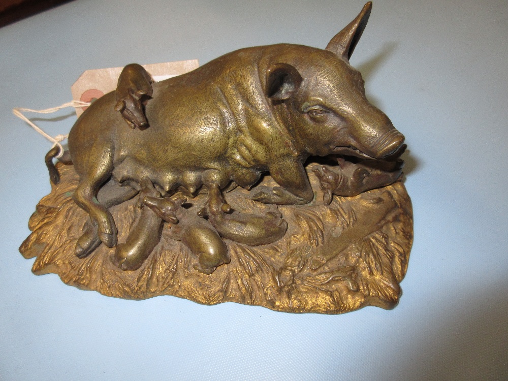 Small 20th Century gilded bronze figure of a sow with piglets on naturalistic base