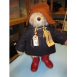 Soft toy figure of Paddington Bear with wellington boots, hat,