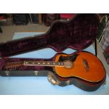 Kawai twelve string guitar in a Gibson hard shell case