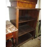 20th Century oak open bookcase having three deep shelves raised on a plinth base (a/f)