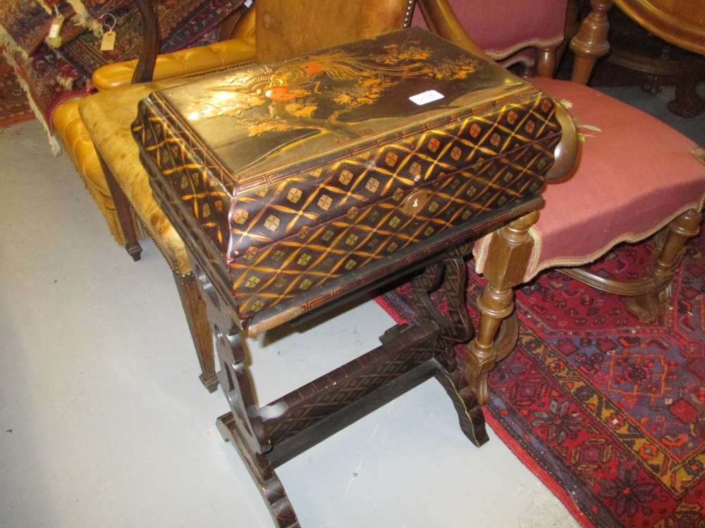 Chinese rectangular lacquered and gilded work box on stand