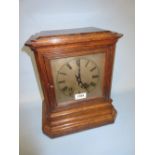 Early 20th Century oak cased bracket clock, the silvered dial with Roman numerals,