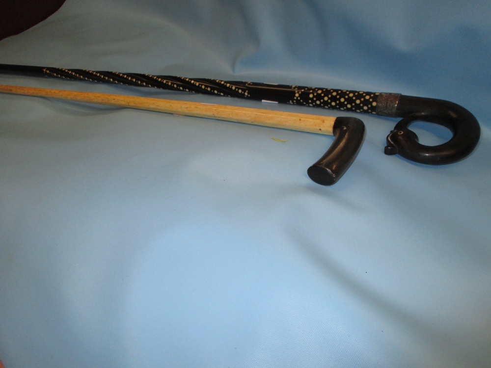 Ebony silver collared and inlaid walking cane, the handle in the form of a bird's head,