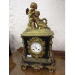 19th Century French ormolu and slate mantel clock mounted with a figure of a seated winged cherub