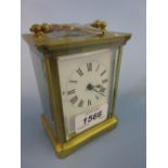Gilt brass cased carriage clock with an enamel dial and Roman numerals