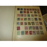 Five various albums containing a collection of World stamps,