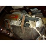 Early 20th Century leather cricket bag containing a quantity of various cricket pads and