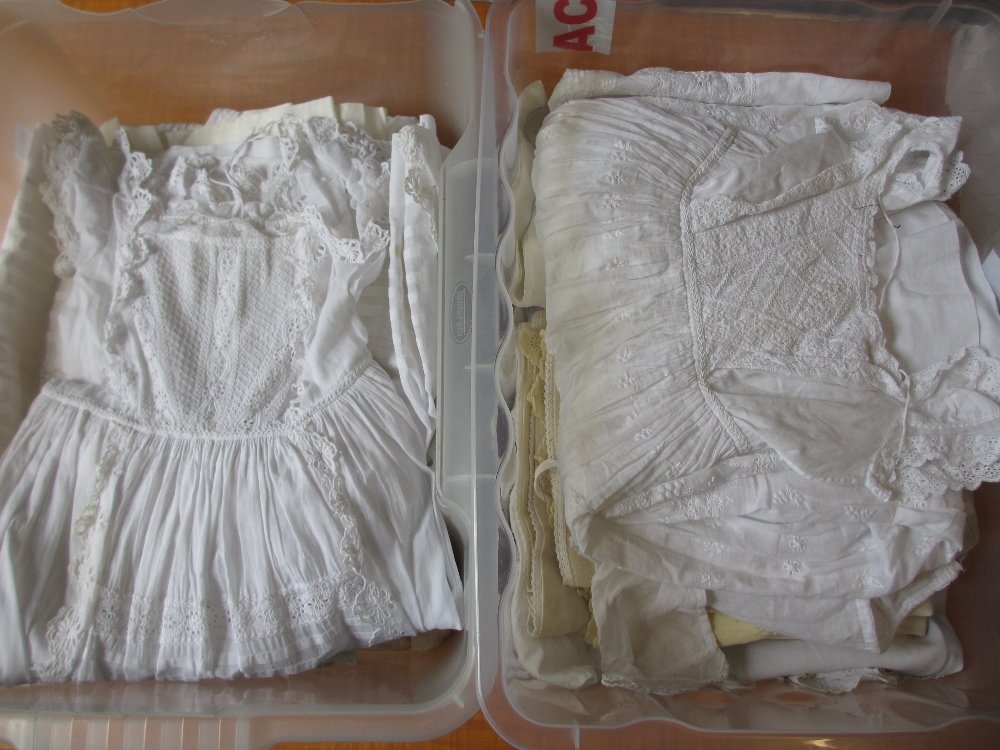 Large collection of Victorian and vintage embroidered baby gowns and dresses