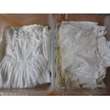 Large collection of Victorian and vintage embroidered baby gowns and dresses