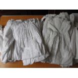 Large quantity of various embroidered and lace baby gowns and Christening robes