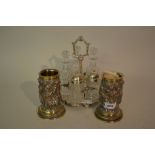 Pair of Elkington and Company silver plated spill vases decorated in high relief with classical