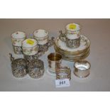 Set of six London silver cup holders (four with cups together with a silver egg cup and two napkin